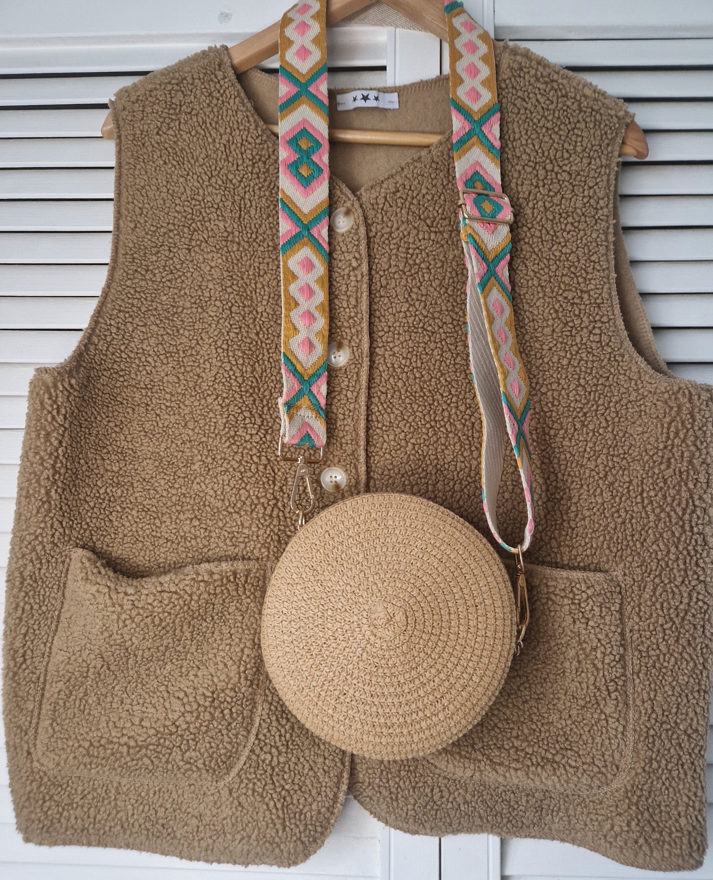 Small, round raffia bag with patterned strap