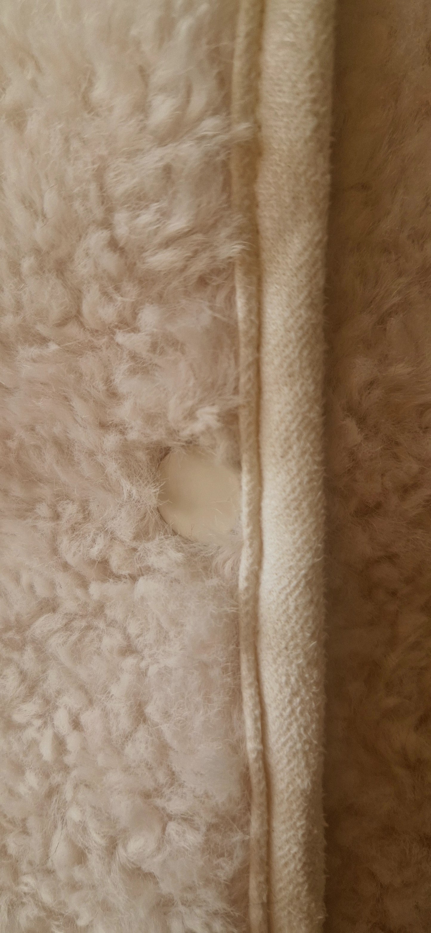 Faux Shearling Gilet in Cream with pockets. Suede feel lining.
