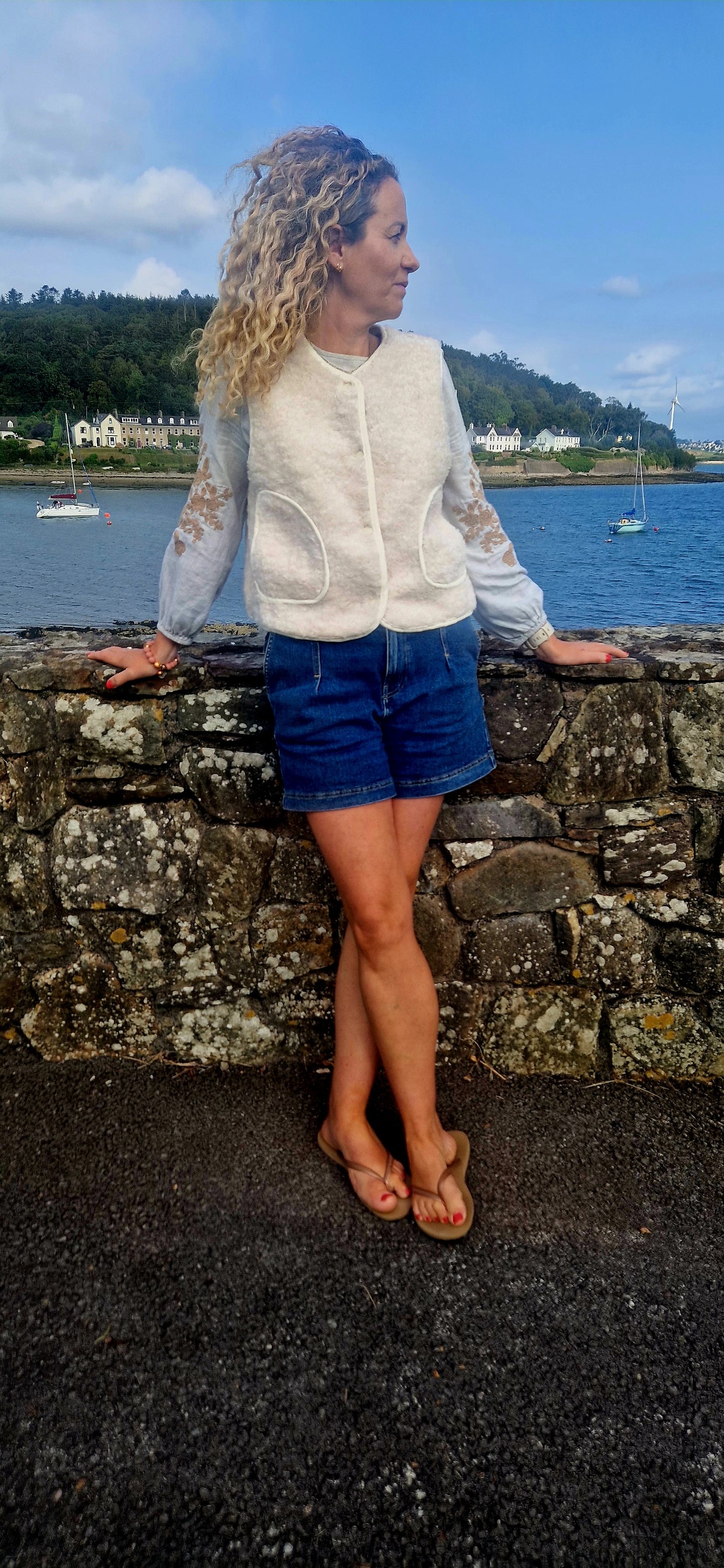 Faux Shearling Gilet in Cream with pockets. Suede feel lining.