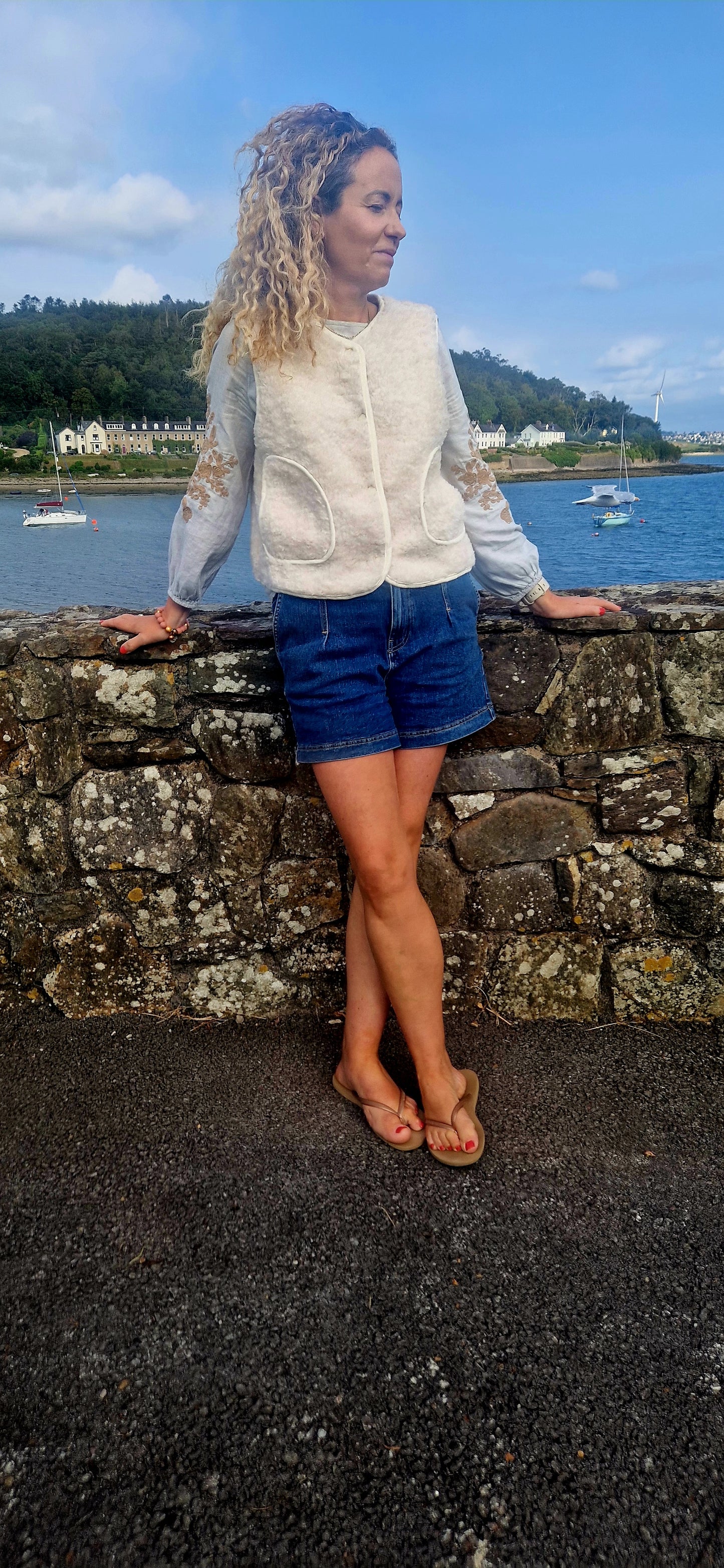Faux Shearling Gilet in Cream with pockets. Suede feel lining.