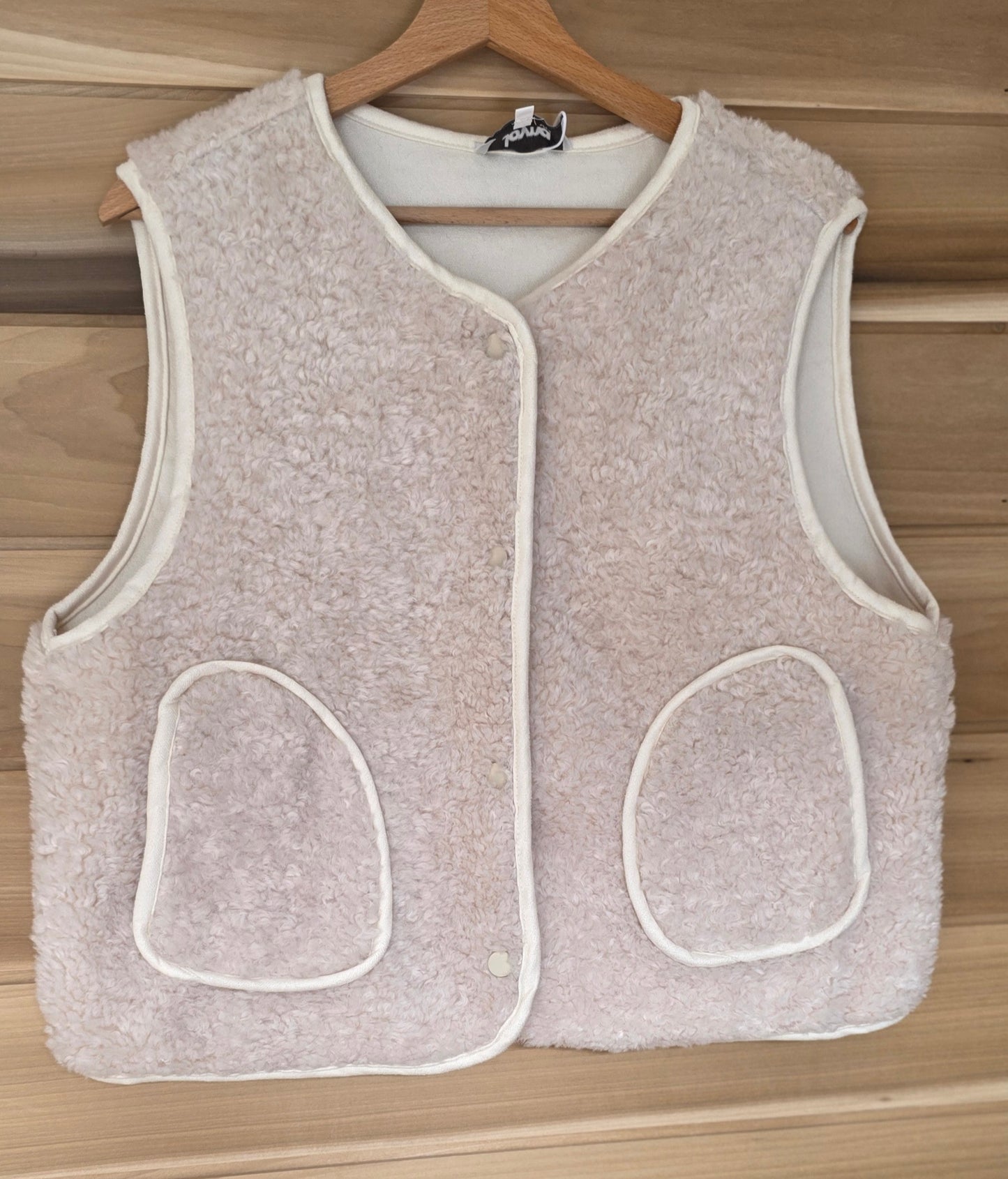 Faux Shearling Gilet in Cream with pockets. Suede feel lining.