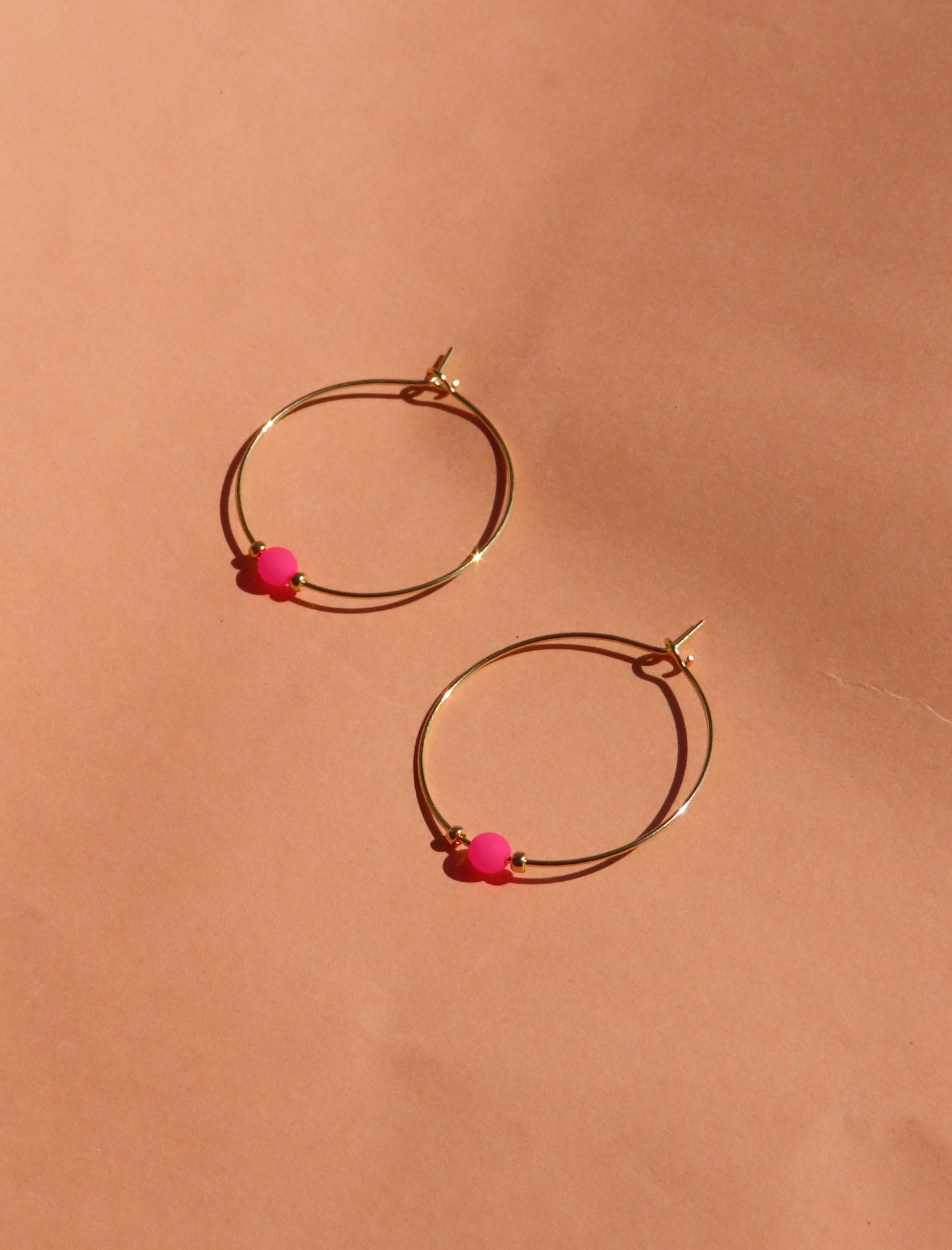 Pink neon pearl on golden stainless steel hoop