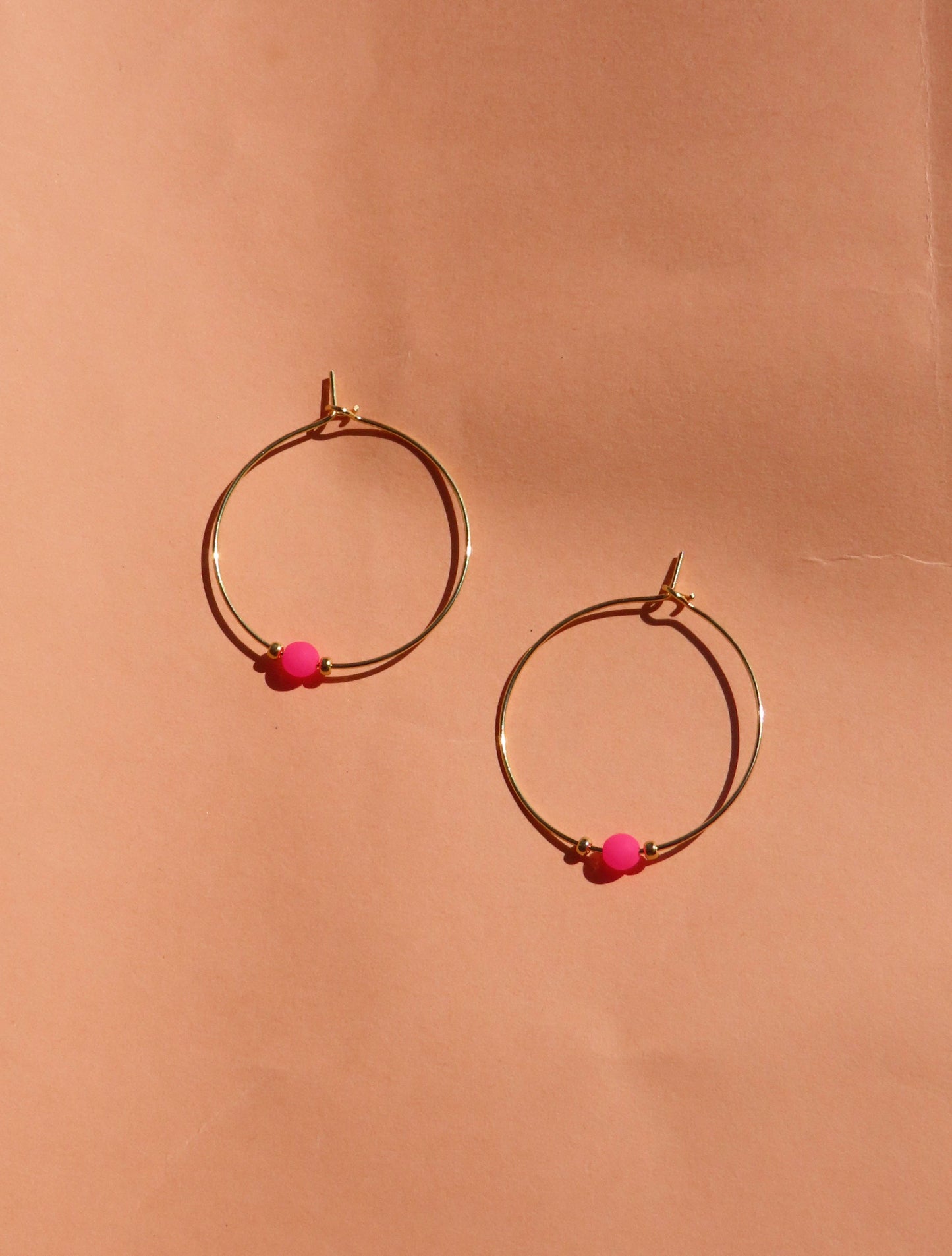 Pink neon pearl on golden stainless steel hoop