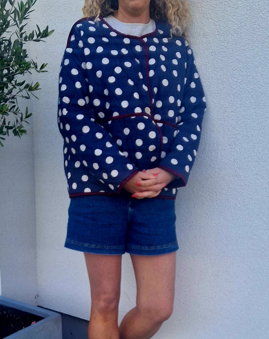 Navy & White dotty quilted, collarless jacket.