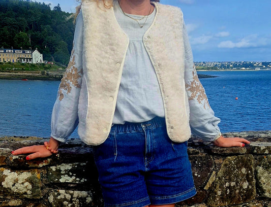 Faux Shearling Gilet in Cream with pockets. Suede feel lining.