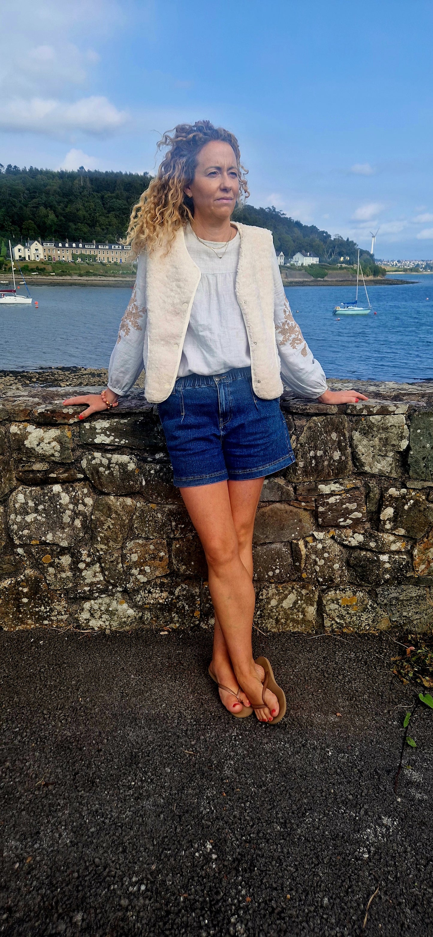 Faux Shearling Gilet in Cream with pockets. Suede feel lining.