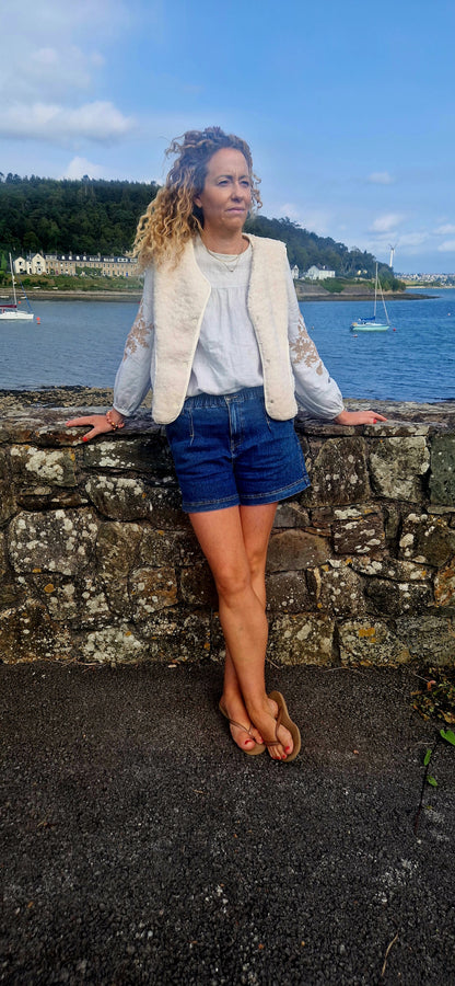 Faux Shearling Gilet in Cream with pockets. Suede feel lining.