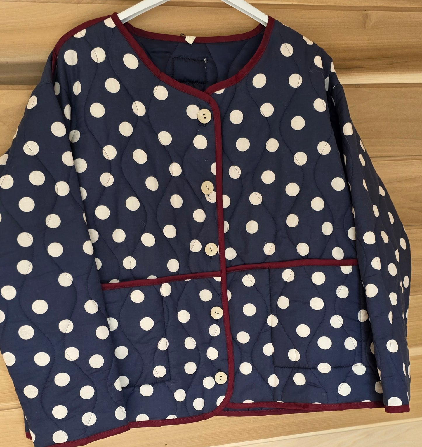 Navy & White dotty quilted, collarless jacket.