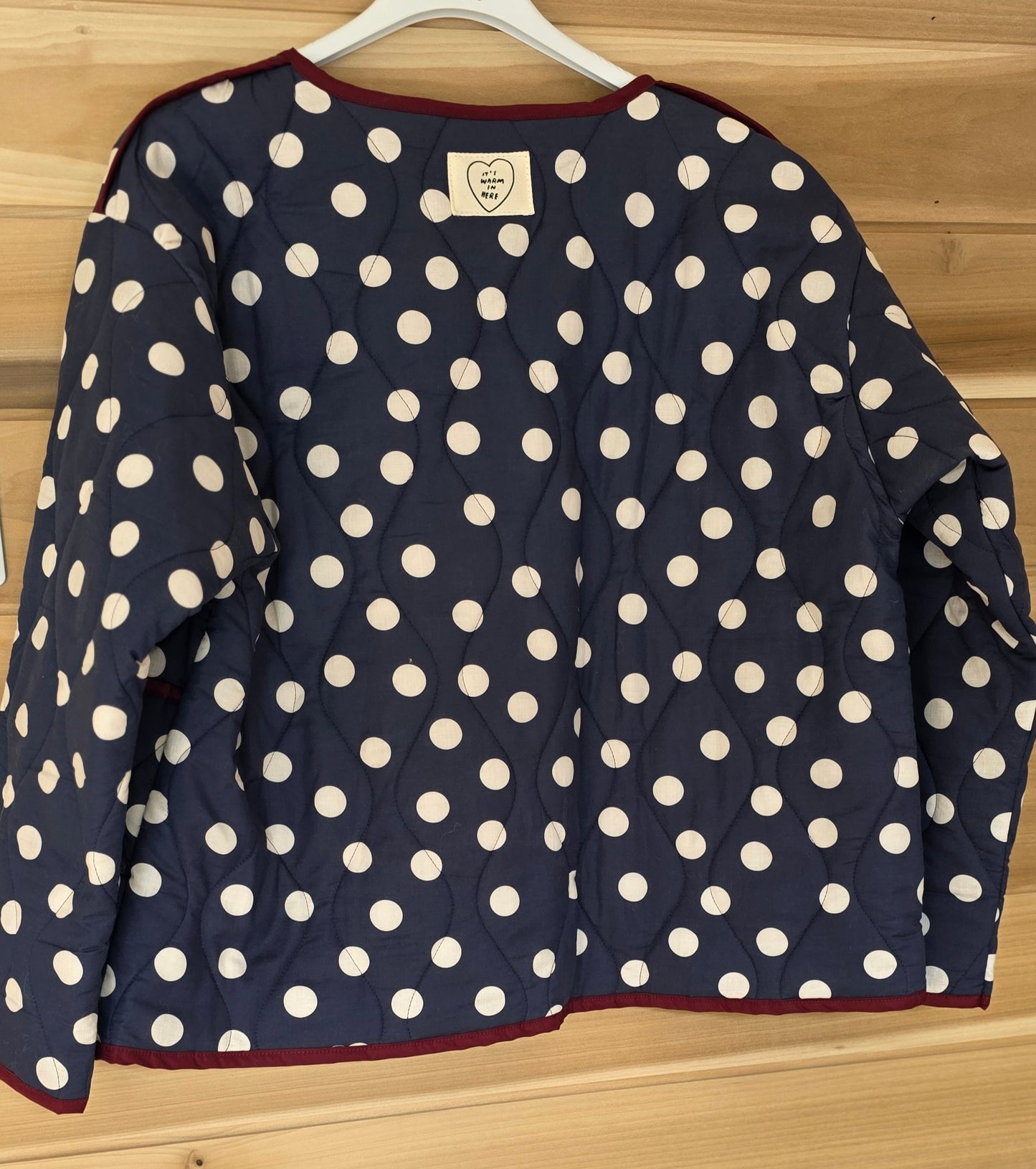 Navy & White dotty quilted, collarless jacket.