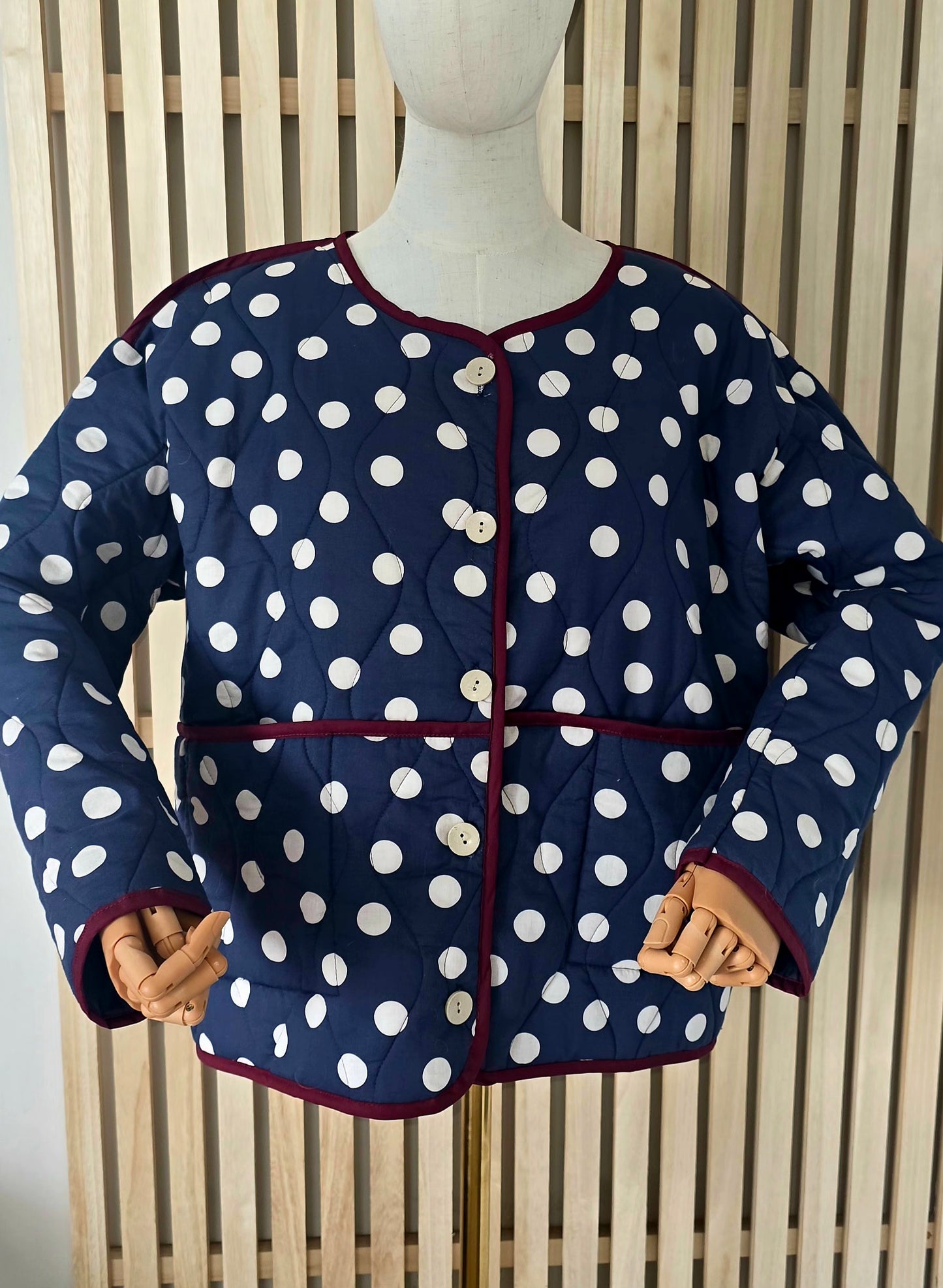 Navy & White dotty quilted, collarless jacket.
