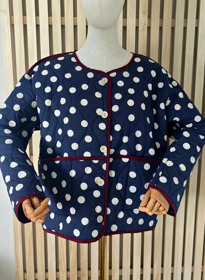 Navy & White dotty quilted, collarless jacket.