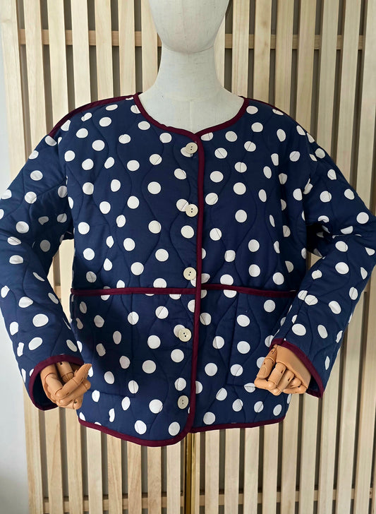 Navy & White dotty quilted, collarless jacket.