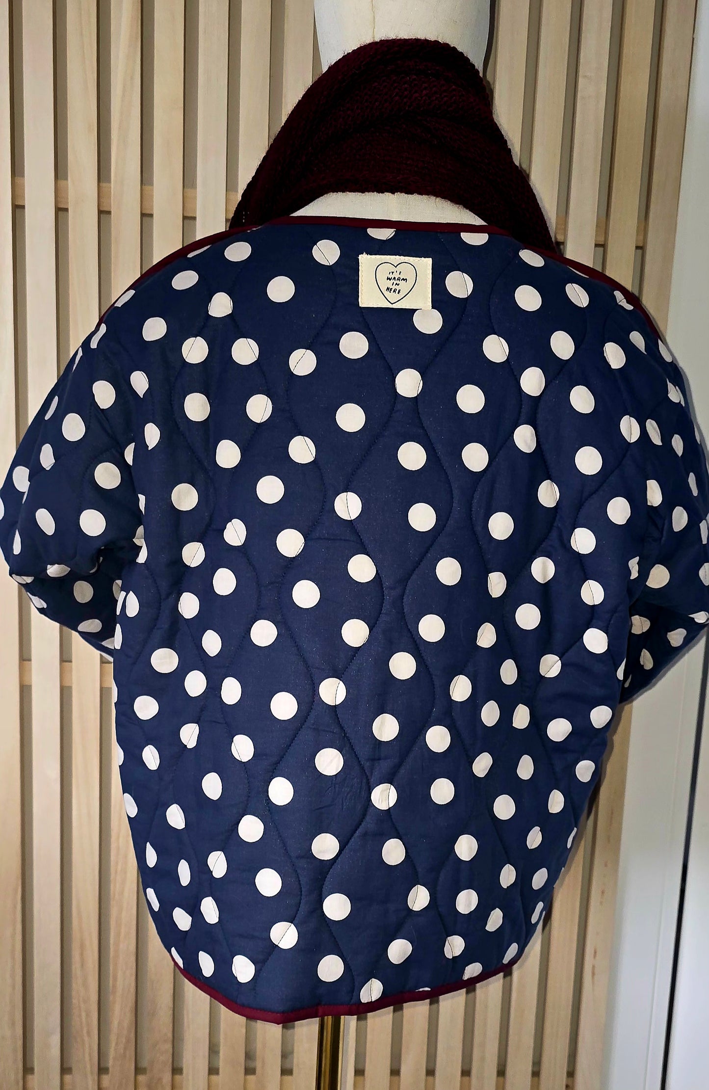 Navy & White dotty quilted, collarless jacket.