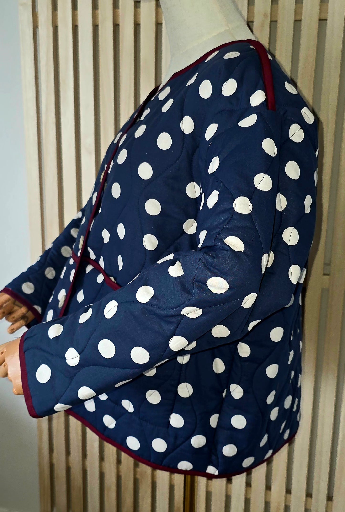 Navy & White dotty quilted, collarless jacket.