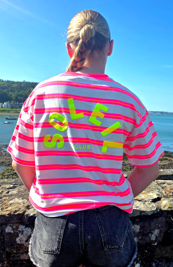 Soleil Club Neon Pink and Orange Striped Tee with Neon Yellow Graphics.
