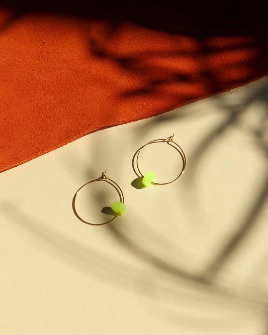 Neon yellow dot hoops made of stainless steel