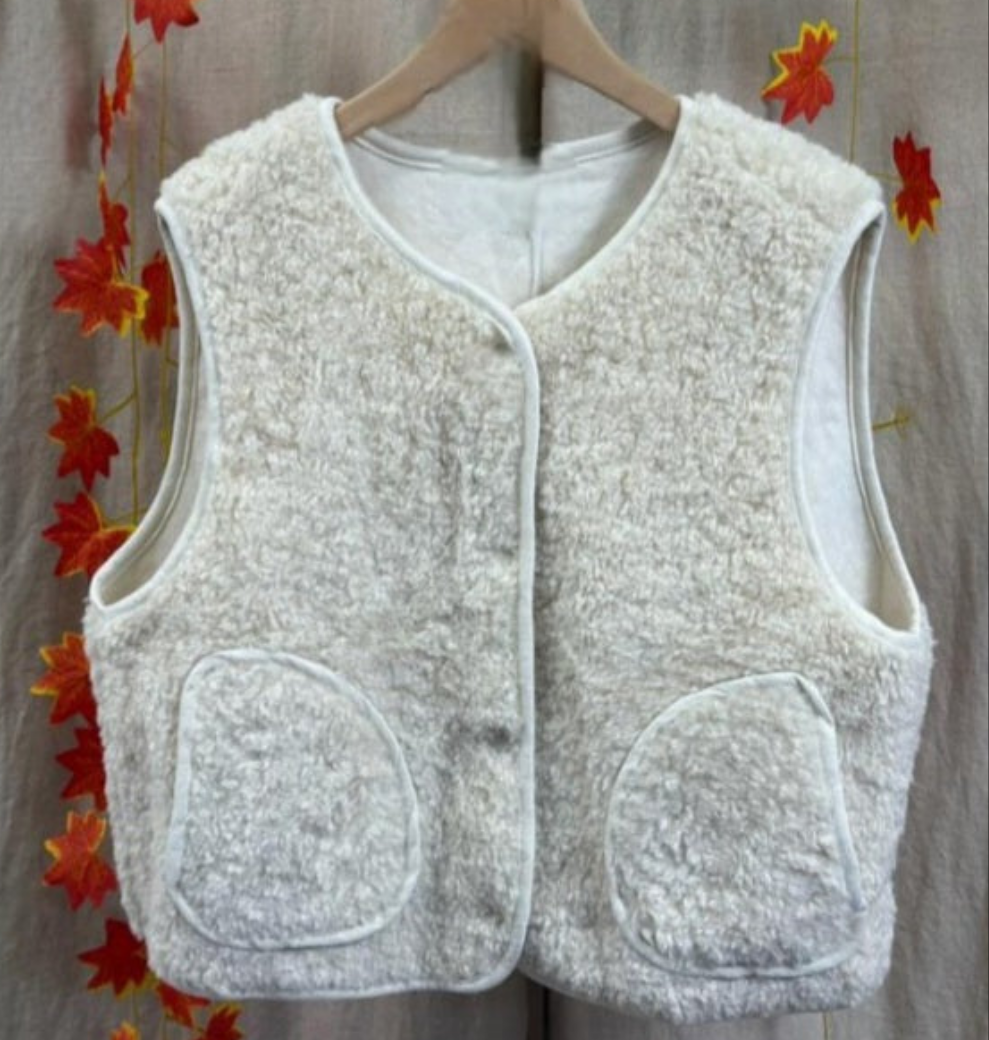 Faux Shearling Gilet in Cream with pockets. Suede feel lining.