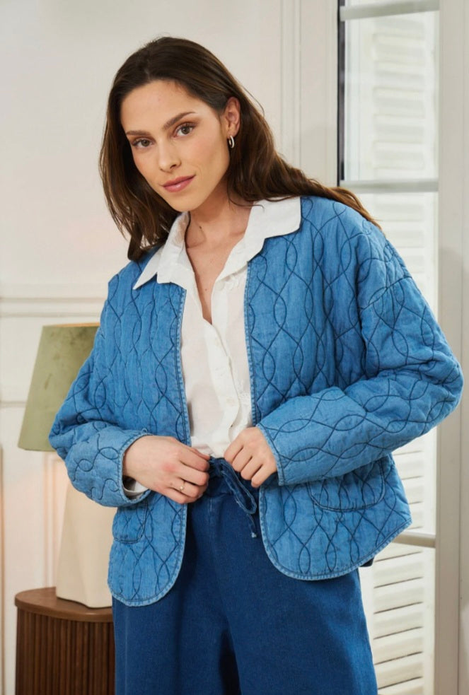 Collarless, Quilted Denim jacket. Open with pockets.